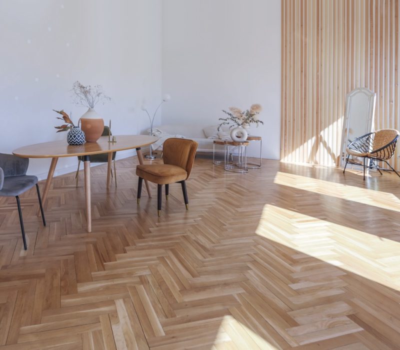 expensive modern light luxury interior design of a spacious living room with wooden elements and white walls. filled with original and unusual decorative things